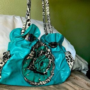 Beautiful turquoise purse with zebra on the bow